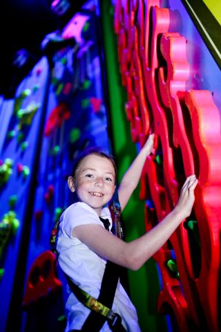 Blacklight Climbing Wall Girl on Blacklight climbing wall at Ards Blair Mayne