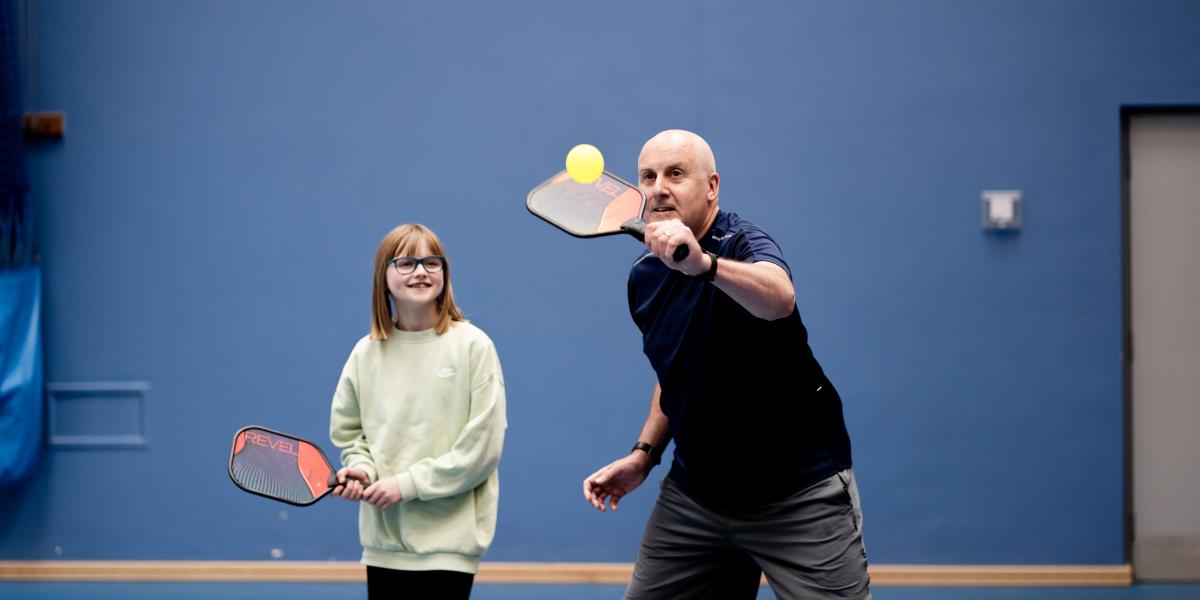 Family playing Pickleball at Comber