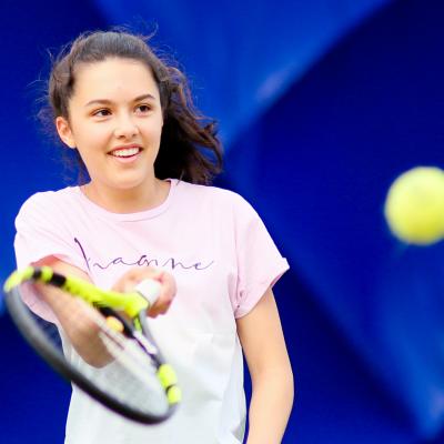 Girl playing Tennis in the Dome at Comber Leisure Centre